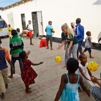 High school students play ball sports with children as part of their volunteer work in Tanzania for teenagers Projects Abroad volunteers play ball sports with children in Tanzania on our placement for teenagers